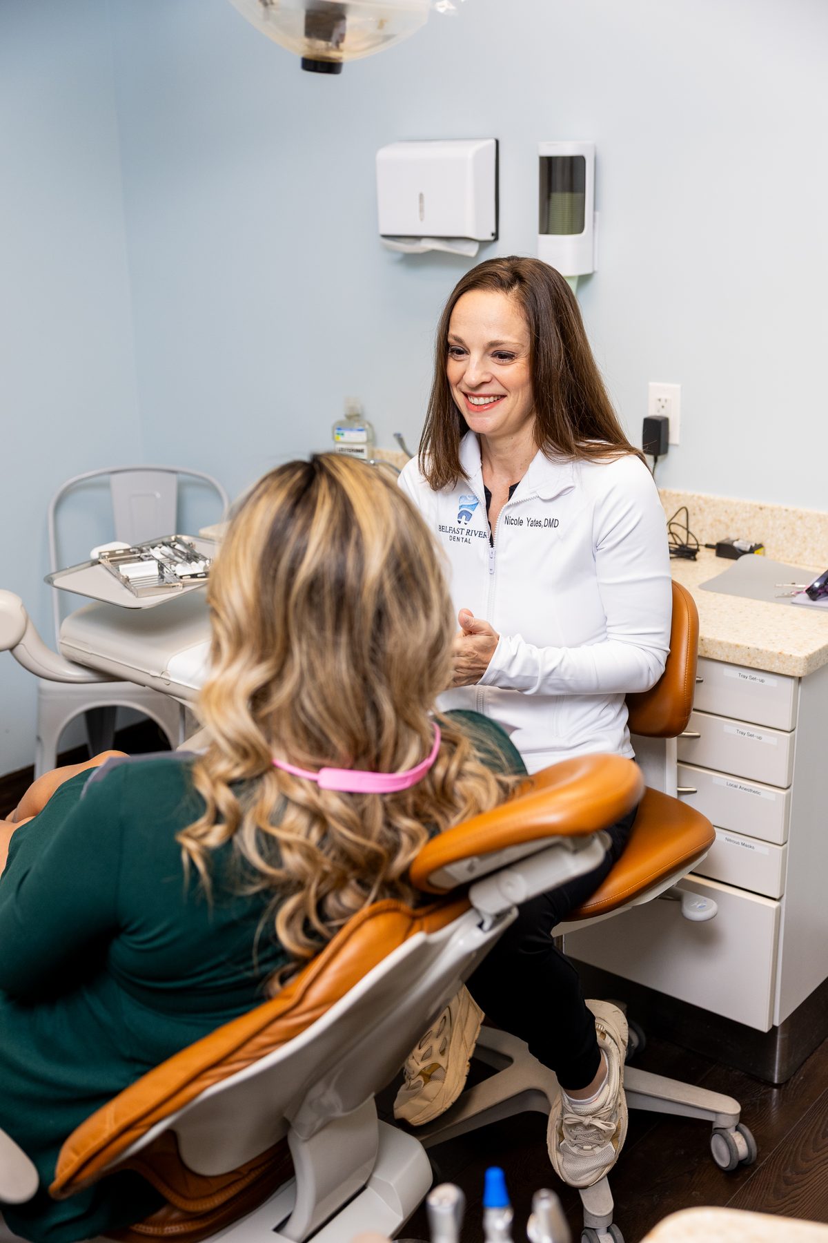 Dr. Yates in conversation with a patient at Belfast River Dental